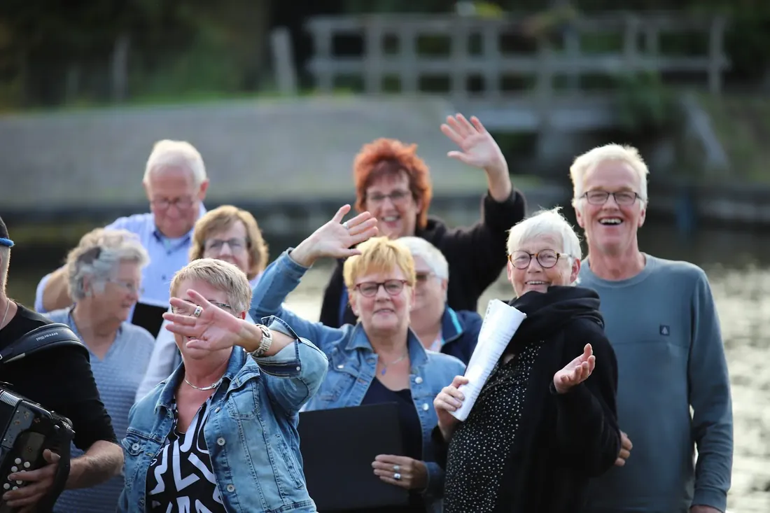 Choir on the pont: Waving to the people eating on the terrace