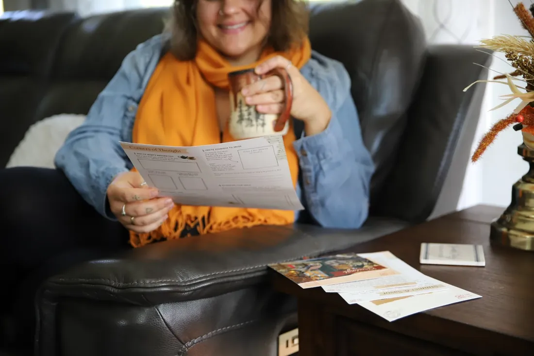 Reading the Corners of Thought page on the couch, tea in hand