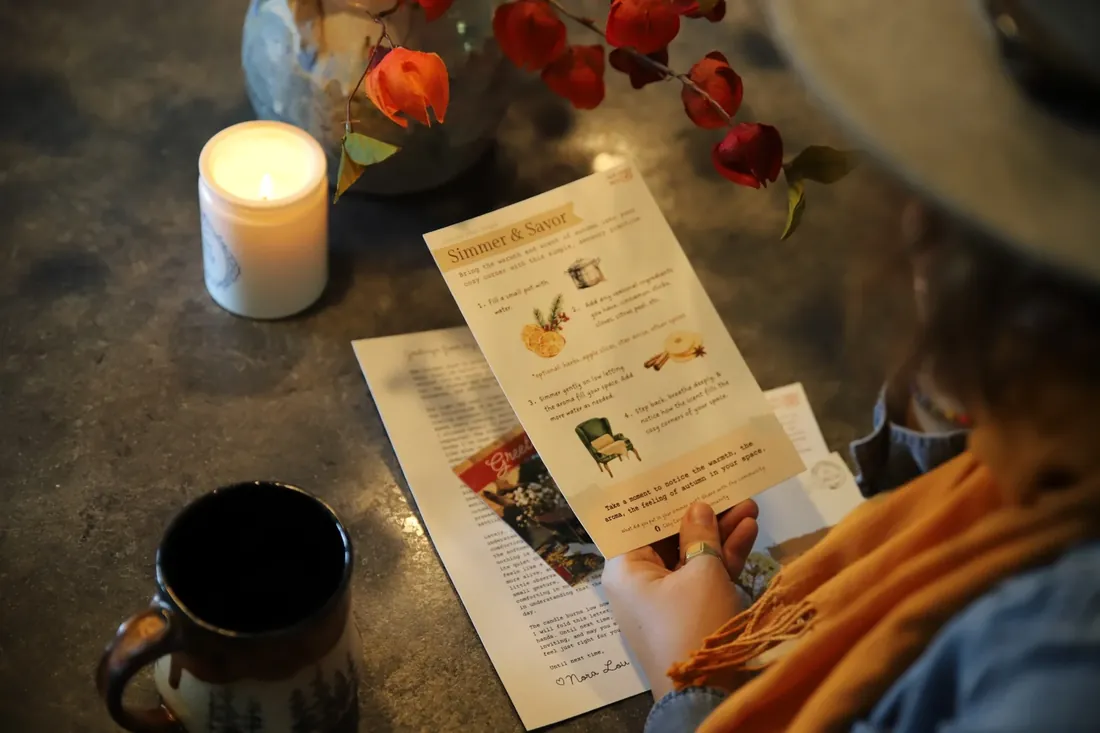 The Simmer & Savor card by candlelight, the letter underneath