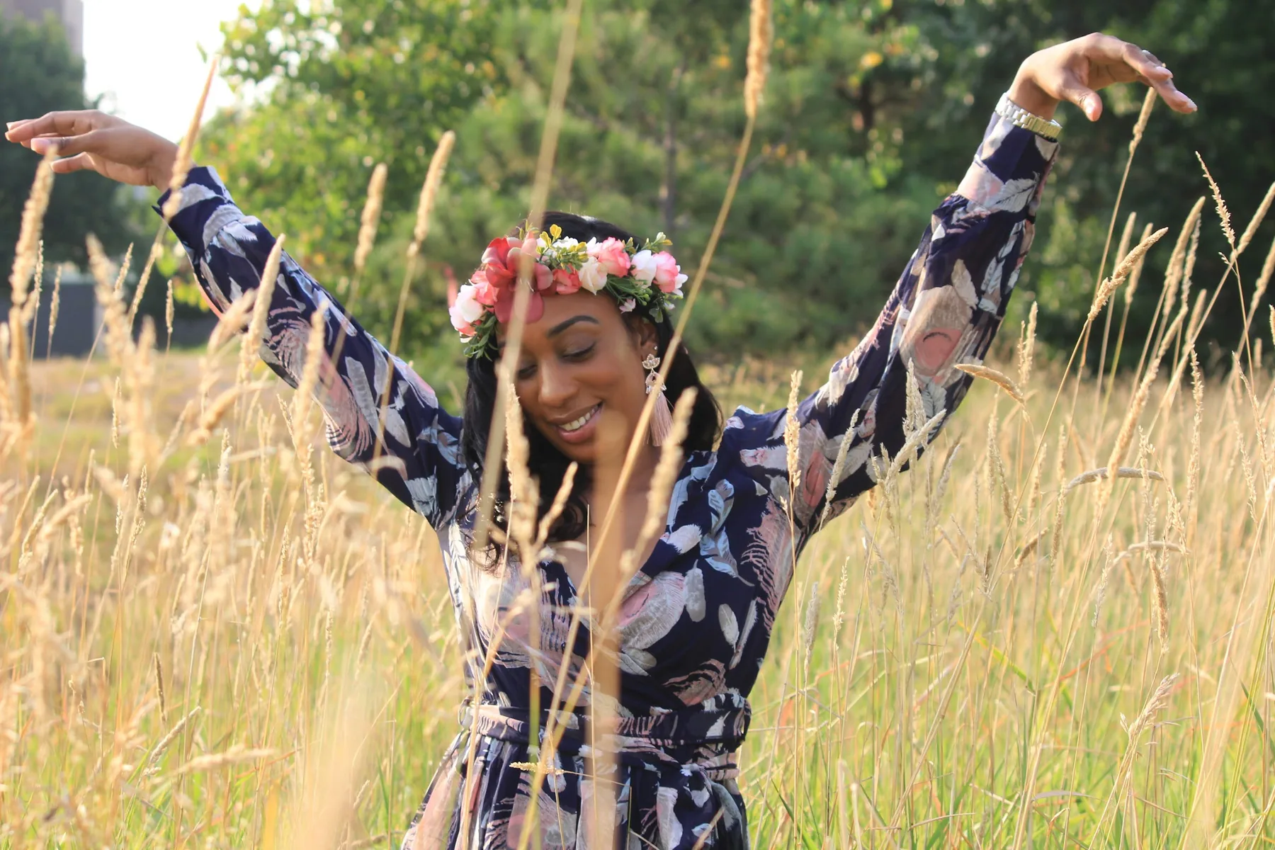 Arms up in the long summer grass