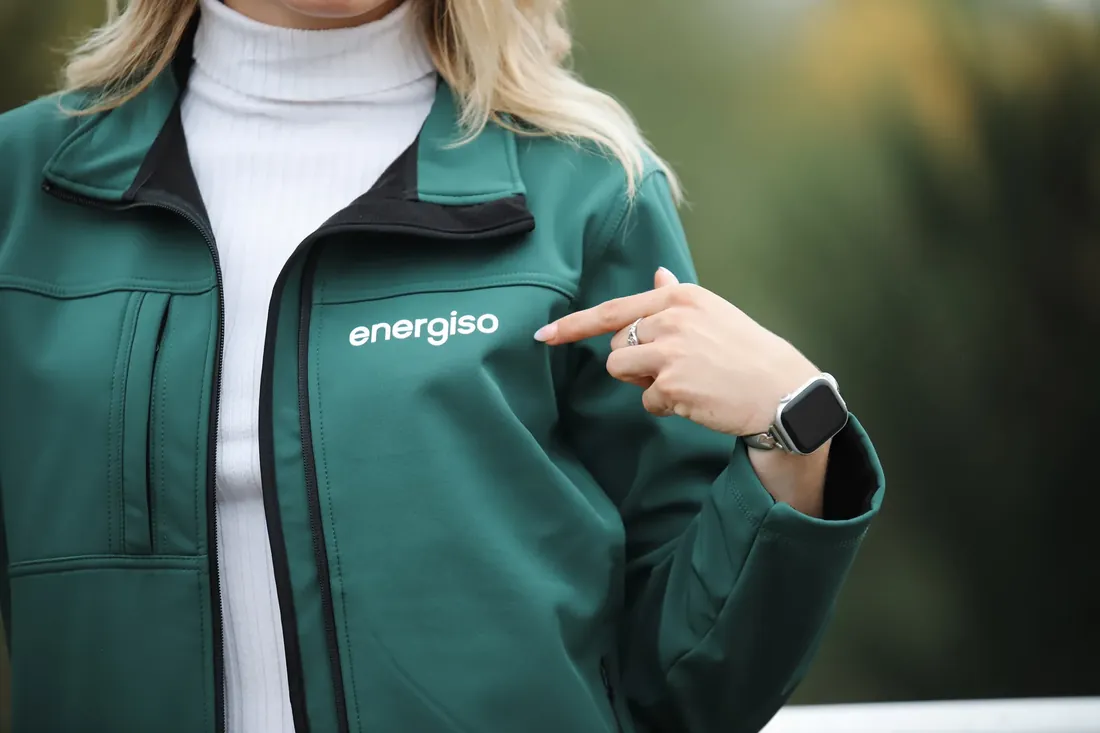 Pointing out the logo on the jacket