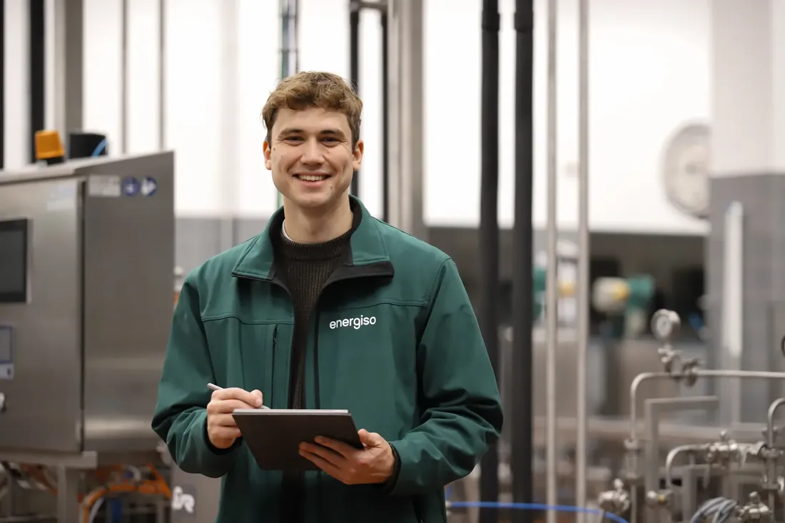 A portrait with the tablet in the plant room