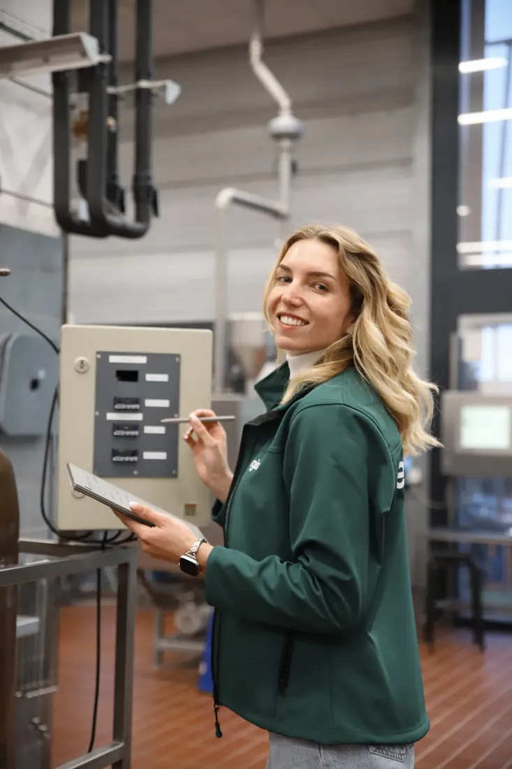 Smiling by the control panel