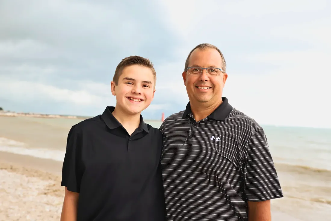 Father and son by the water