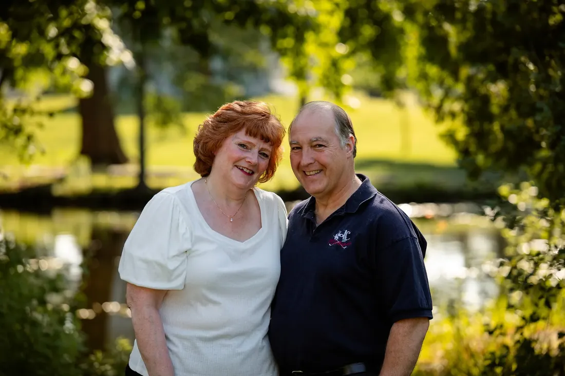 A couple by the pond in late light