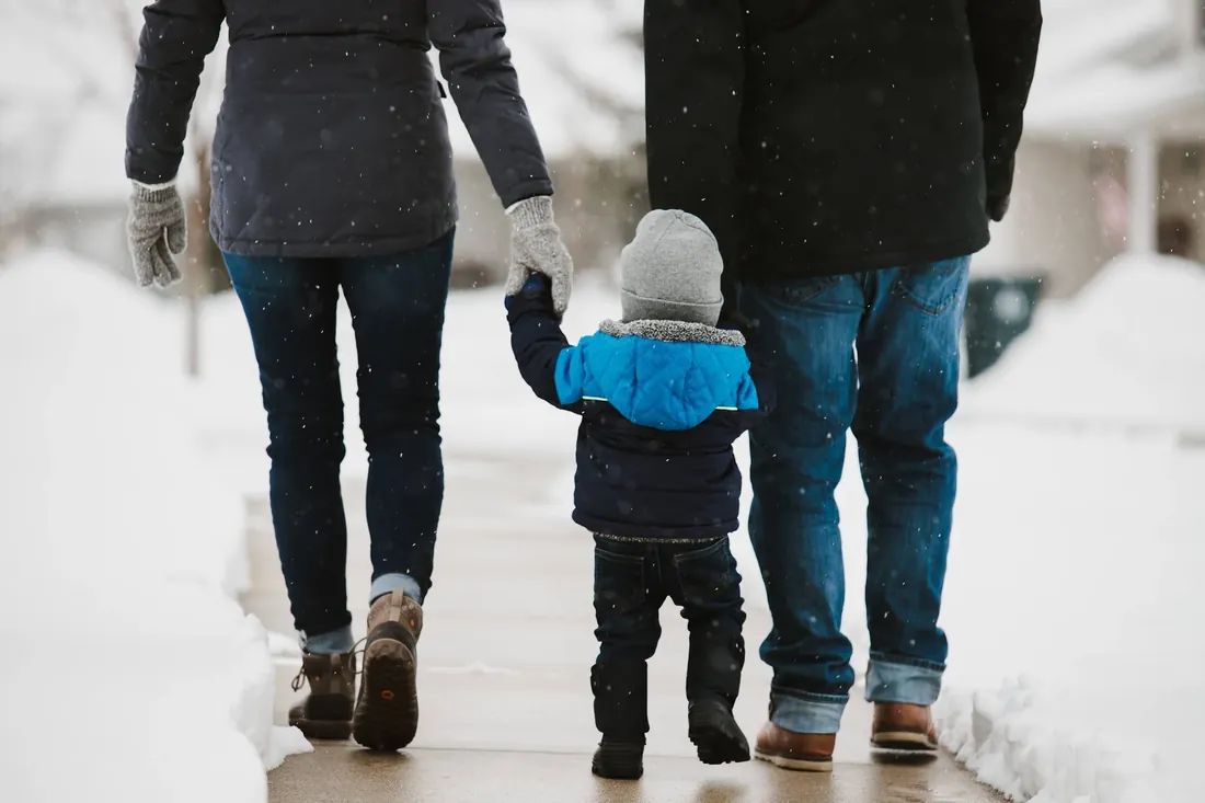 A walk in the snow, holding on to both of them