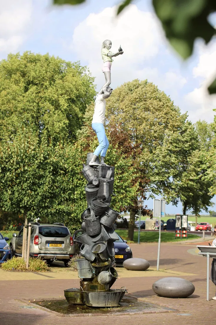A tall statue in the village square