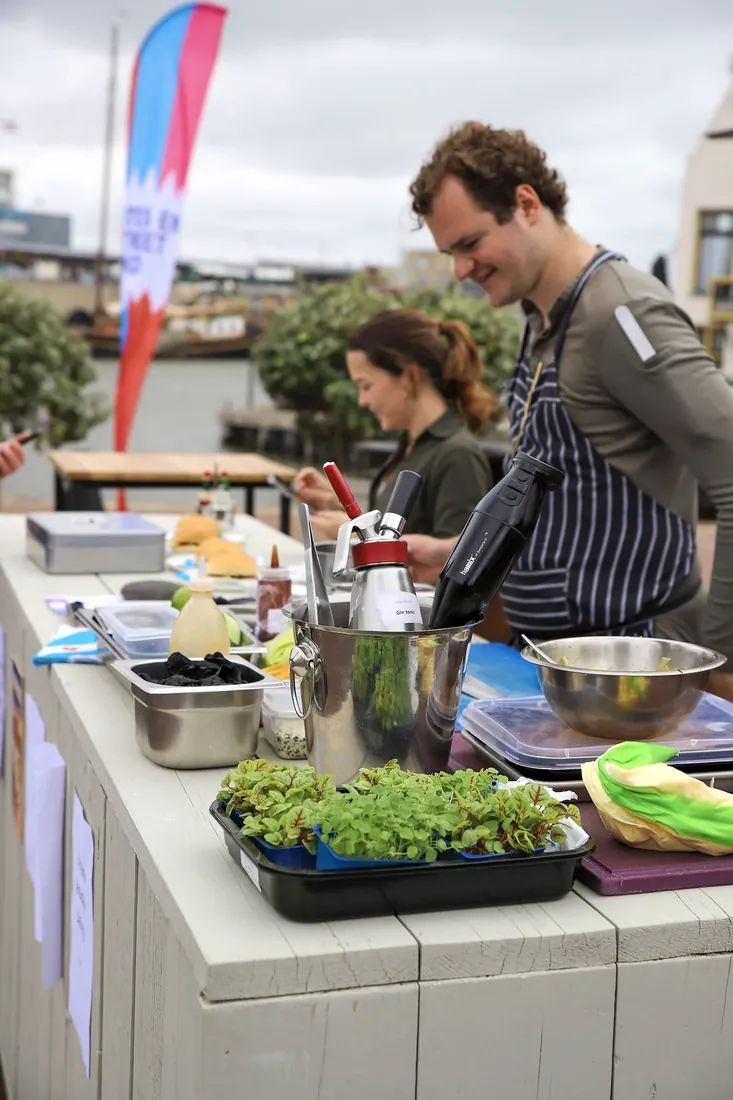 Cooking at a street-food stall on the quay