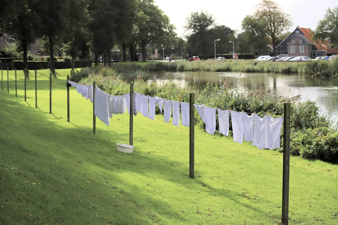 Washing drying on a line along the canal