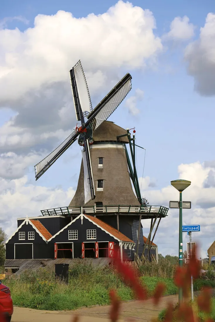 A windmill under big clouds