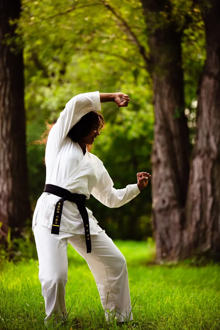Black belt: Fighting stance under the trees