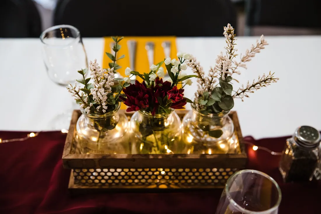 Amanda & Jack: flowers in jars and fairy lights on the table