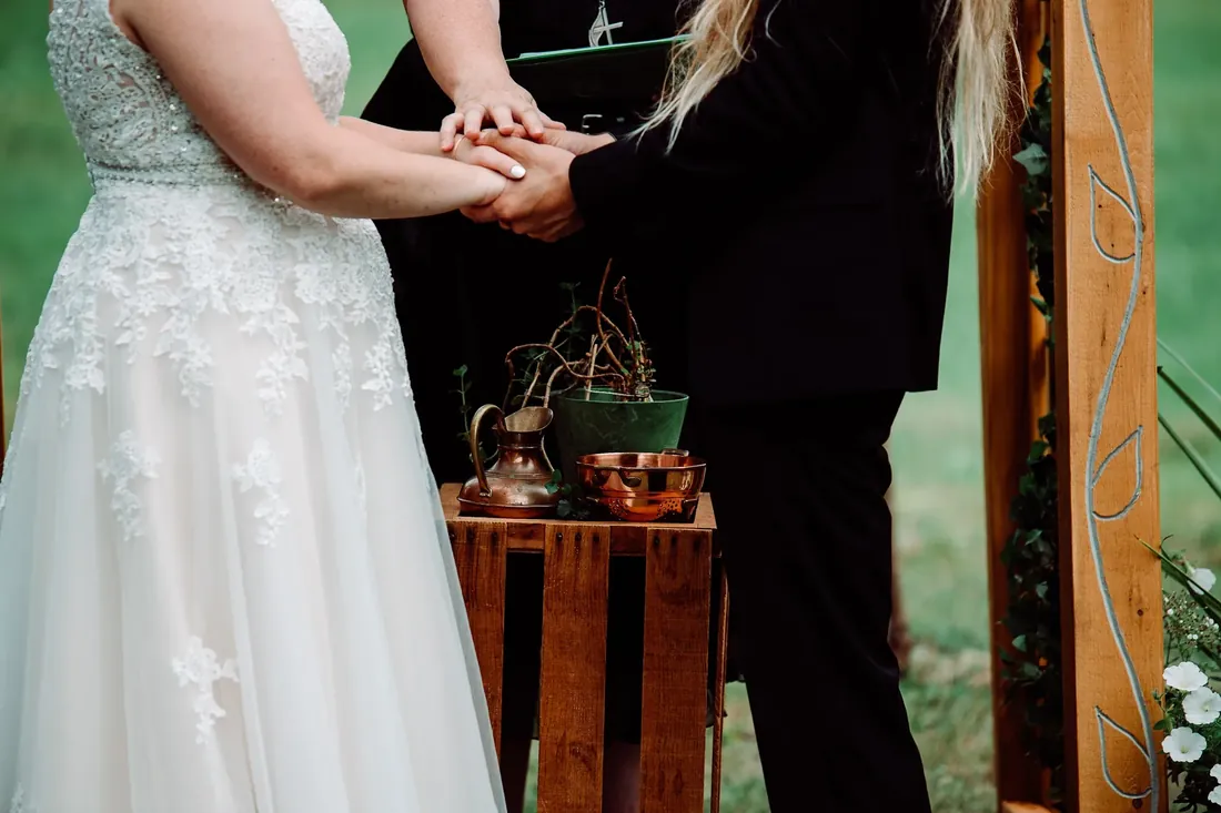 Amanda & Jack: holding hands during the vows
