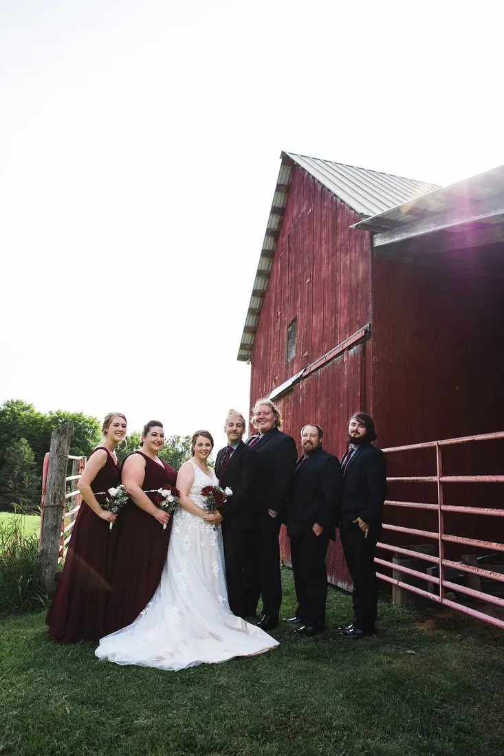 Amanda & Jack: the wedding party along the red barn