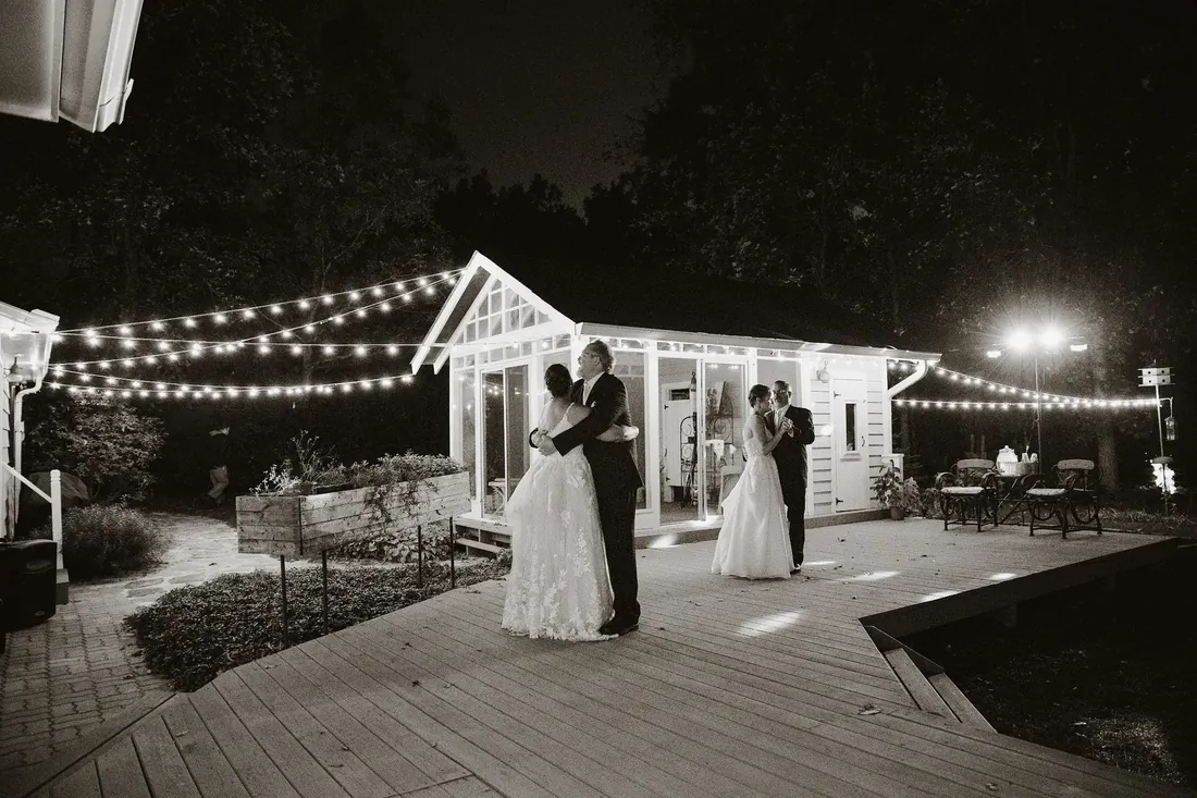 Cece & Erica: dancing on the deck under string lights