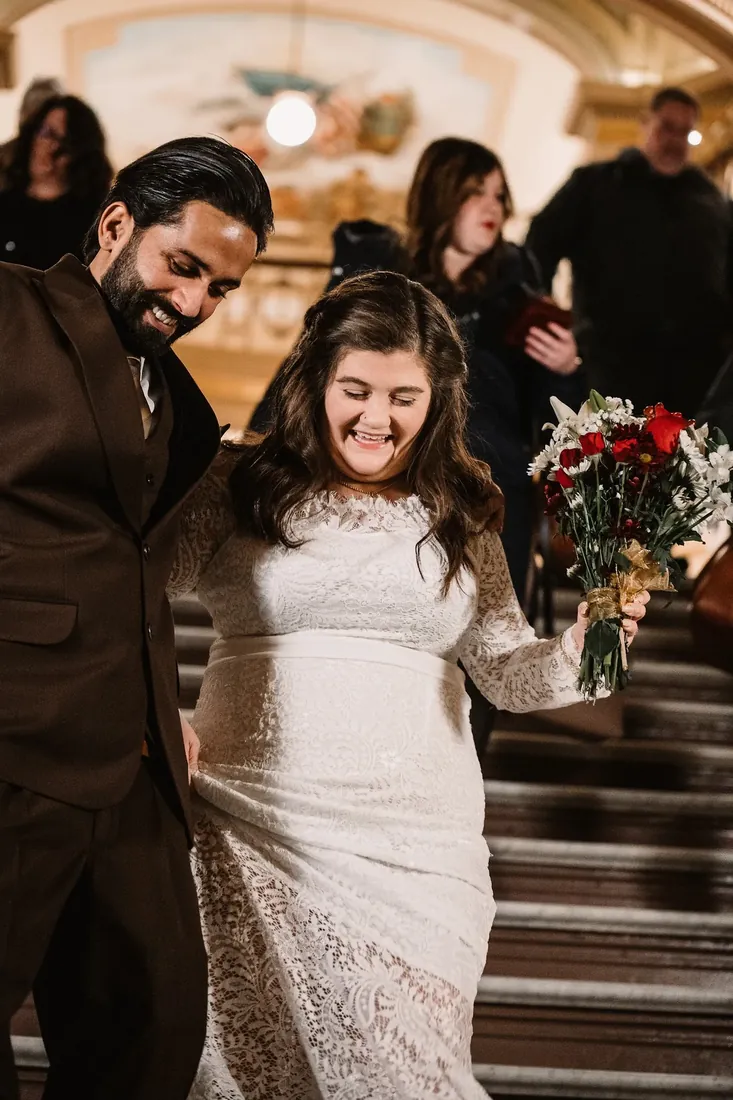 Emily & Samy: laughing on the way down the stairs