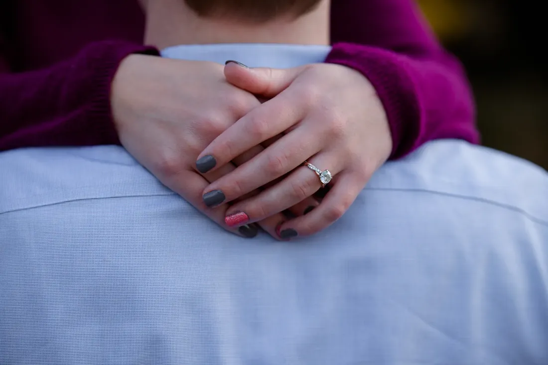 Nancy & Alex: her hands and the ring, wrapped around him