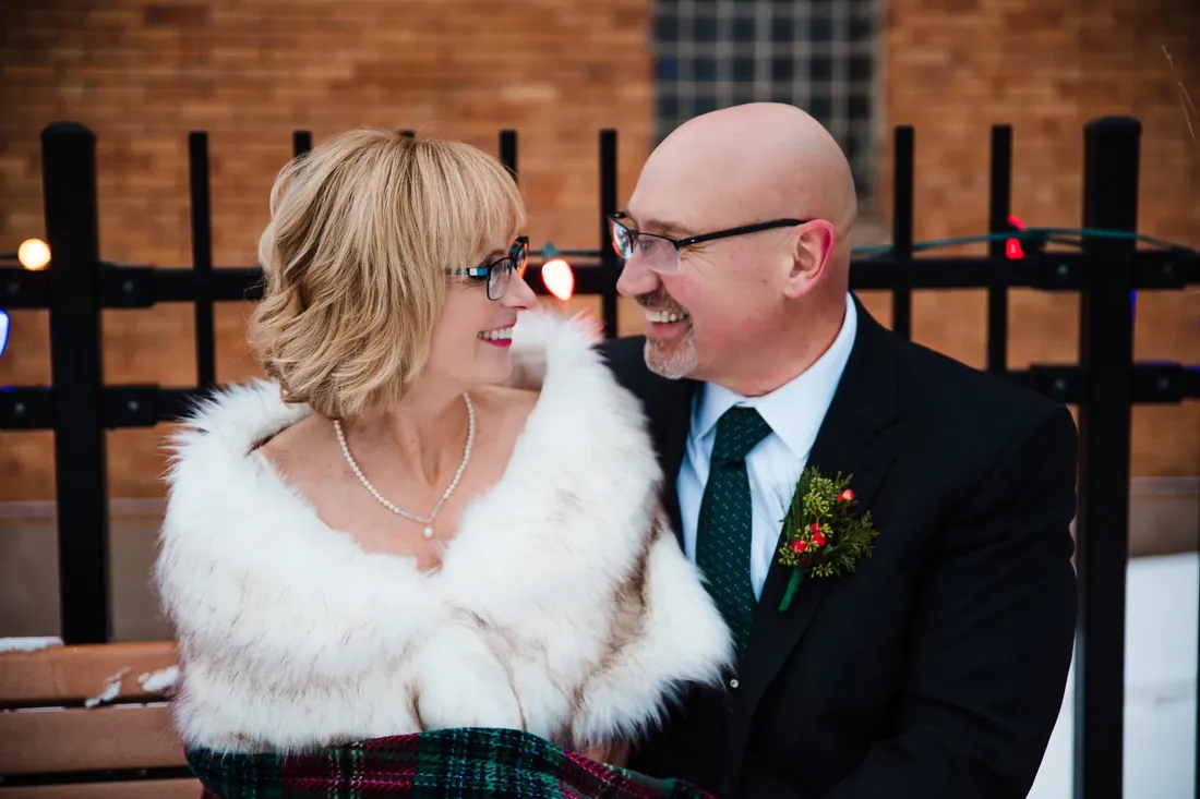 Patty & Craig: a laugh by the iron fence