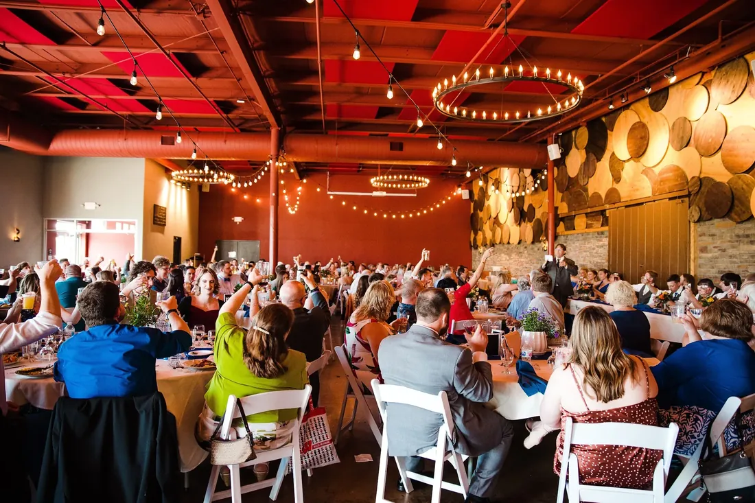 Trisha & Mark: the whole room raising a glass