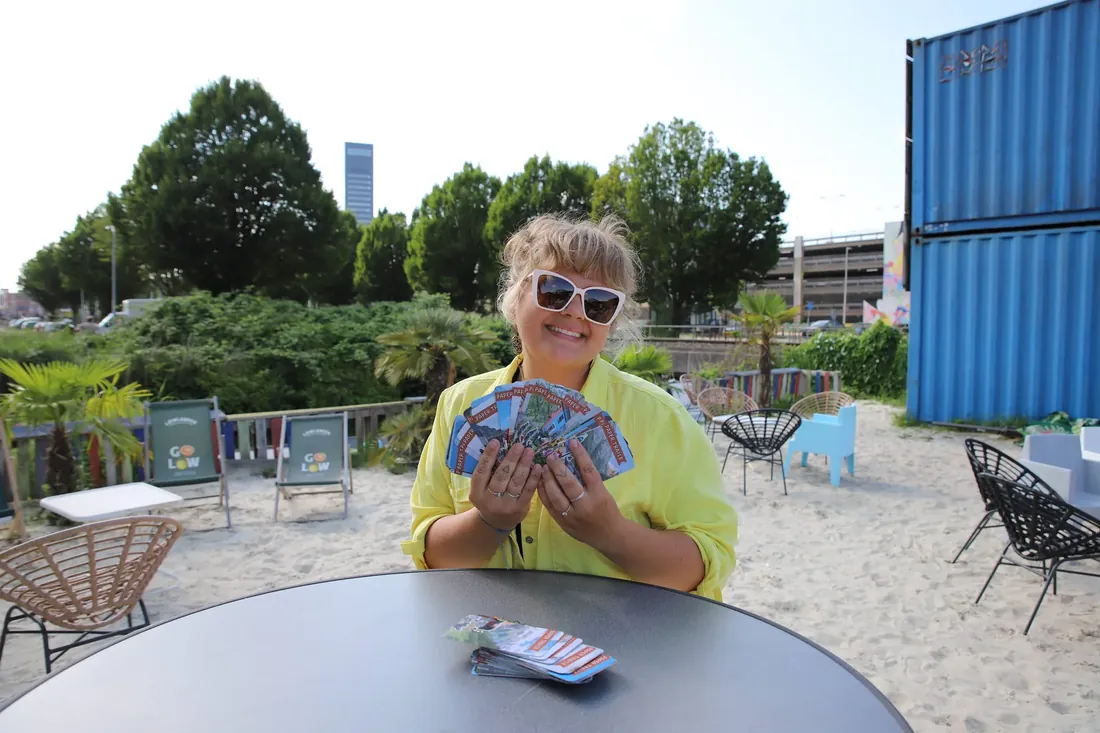 A full hand of cards at the city beach
