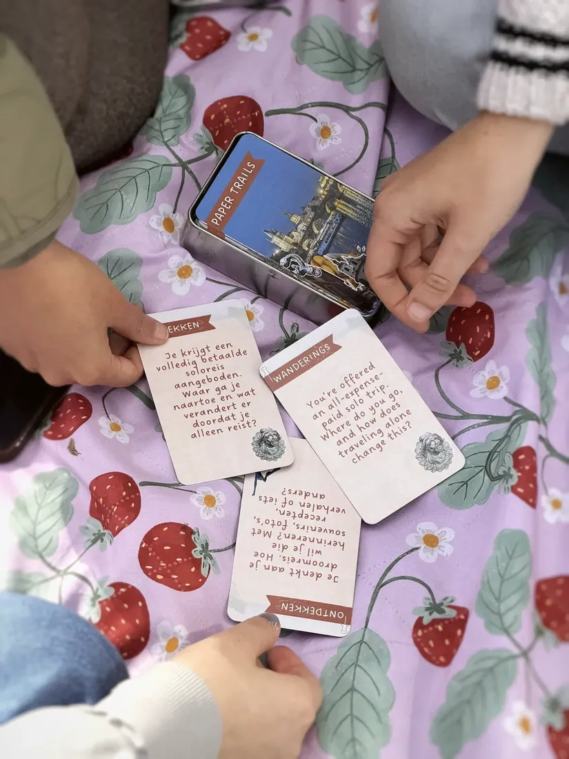 Dutch and English cards side by side on a strawberry blanket