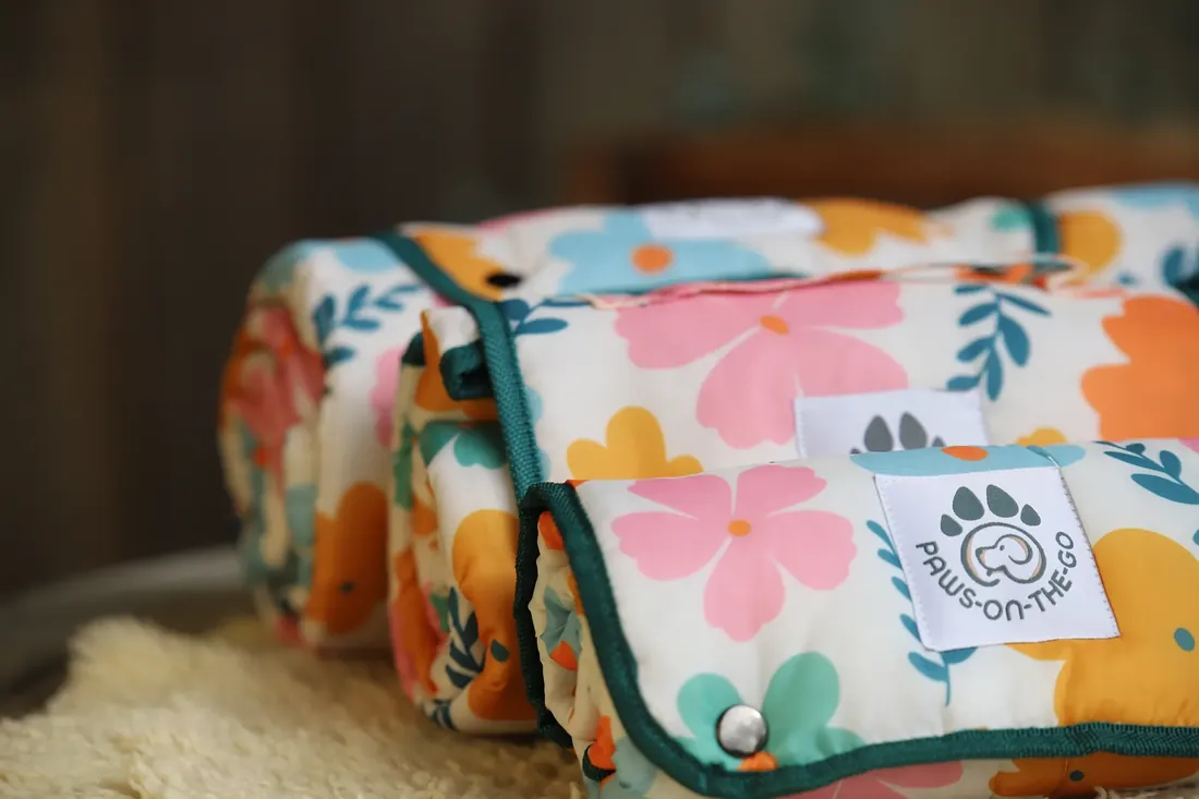The flora print rolled up, label front and centre