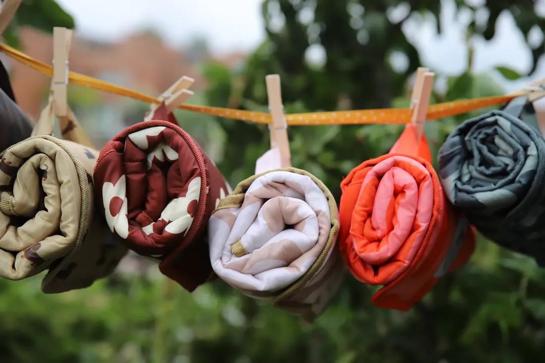 Rolled mats hanging from the line