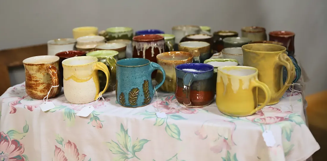Mugs waiting on a table at the wedding
