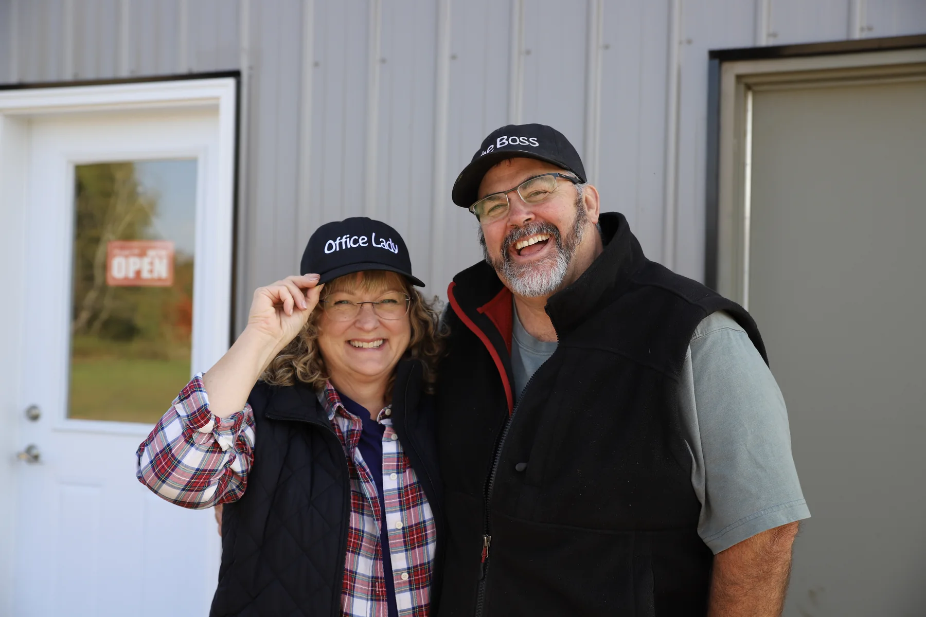 The owners of Sommers Sausage Shop in matching caps