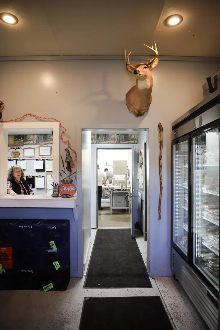 The front counter, the cooler and the mount on the wall