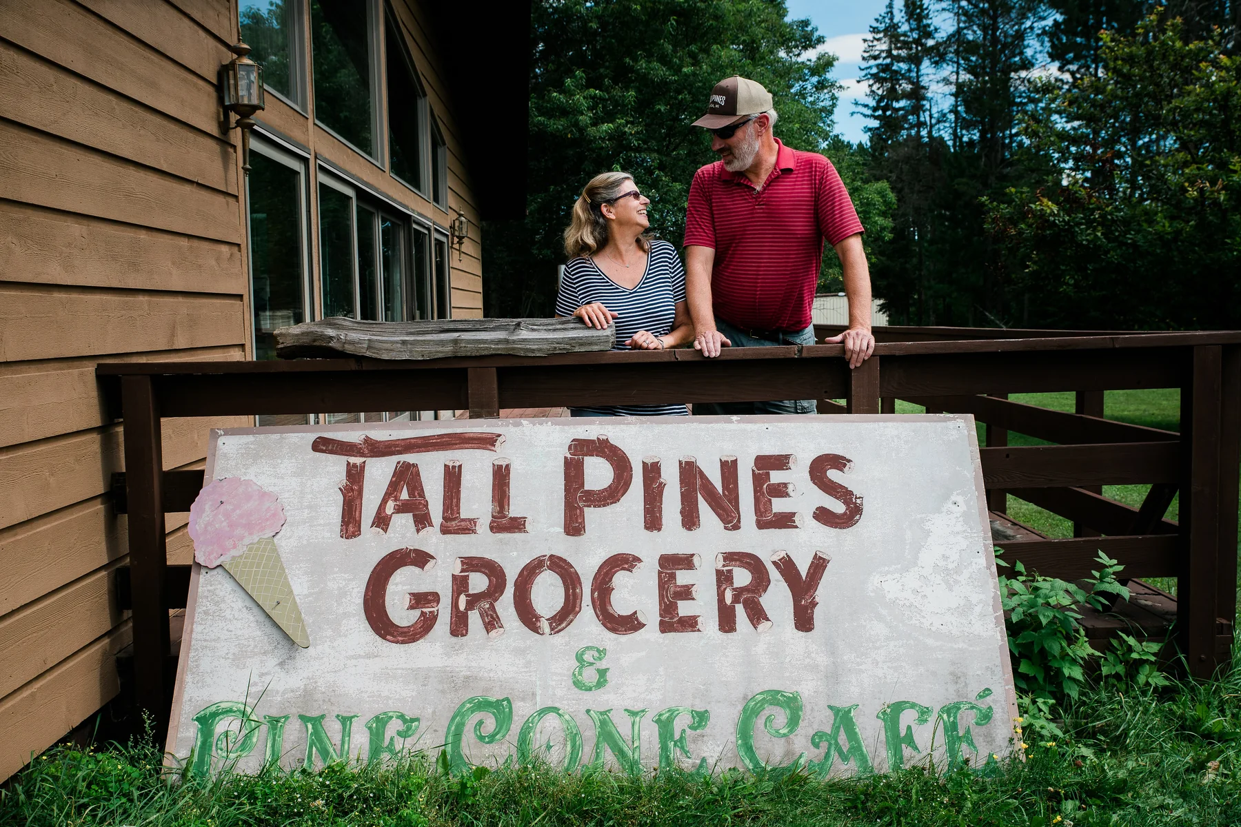 Tall Pines in Amasa, Michigan: Steve and Vinnie at the hand-painted sign, the pumps, the counter and the lake
