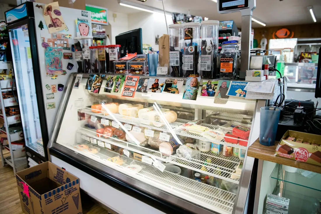 The deli case, with customers’ photos along the top