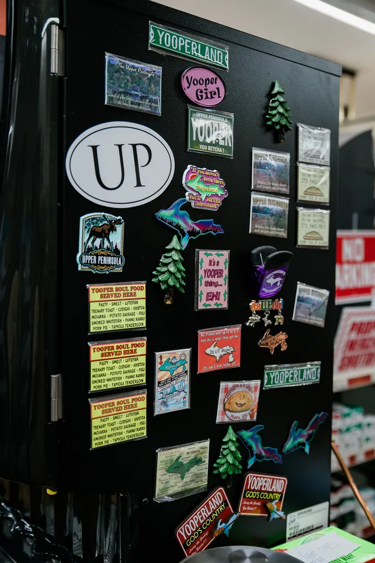 A fridge door full of Upper Peninsula magnets