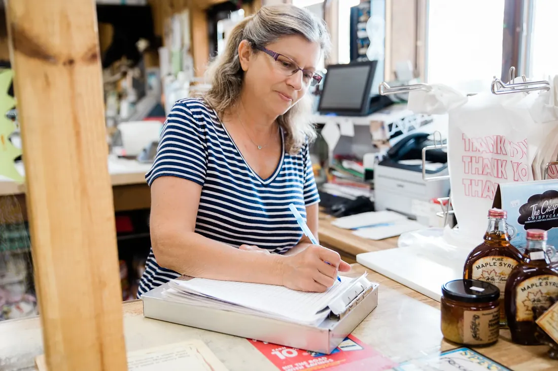 Keeping the books by hand at the counter