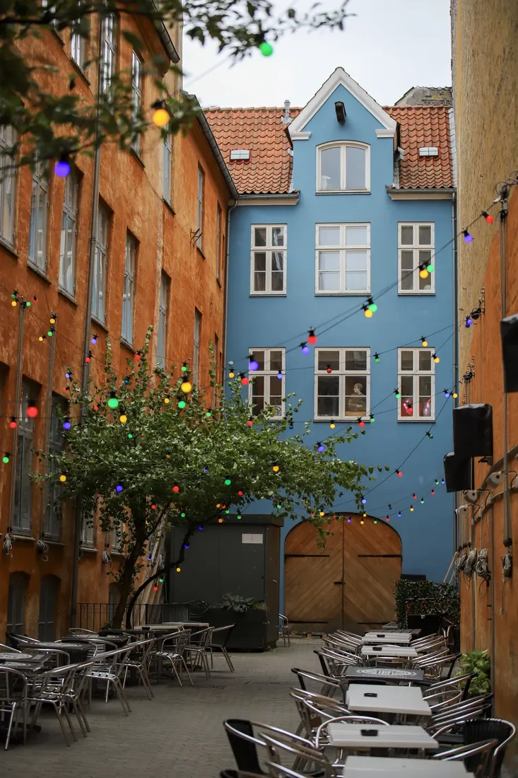 A blue house on a cobbled street