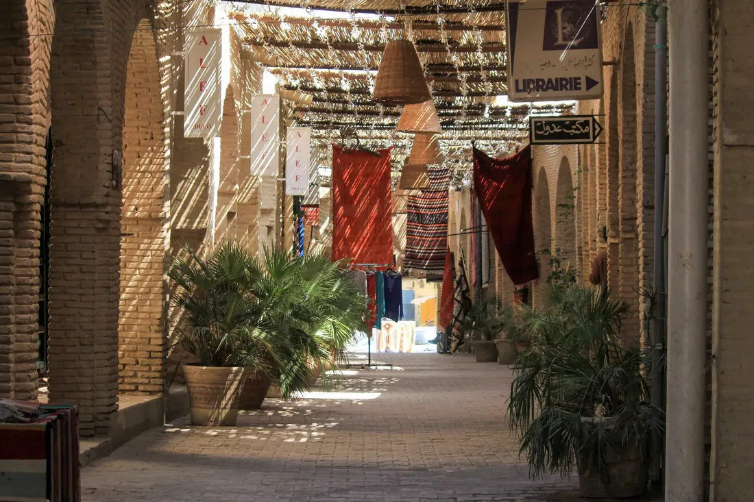A covered lane hung with lanterns, Tunisia