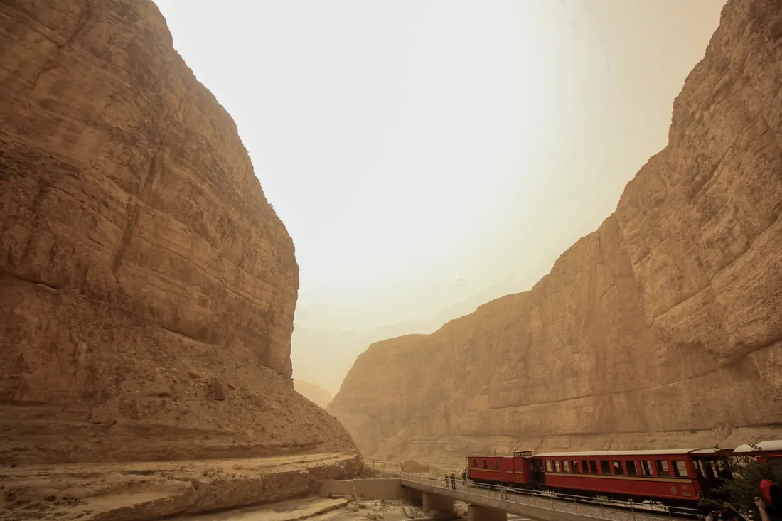 A red train through a desert canyon, Tunisia