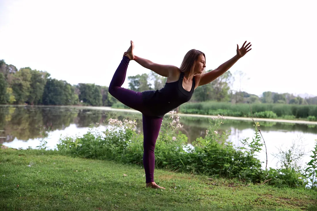 Yoga by the lake: Dancer pose at the water’s edge