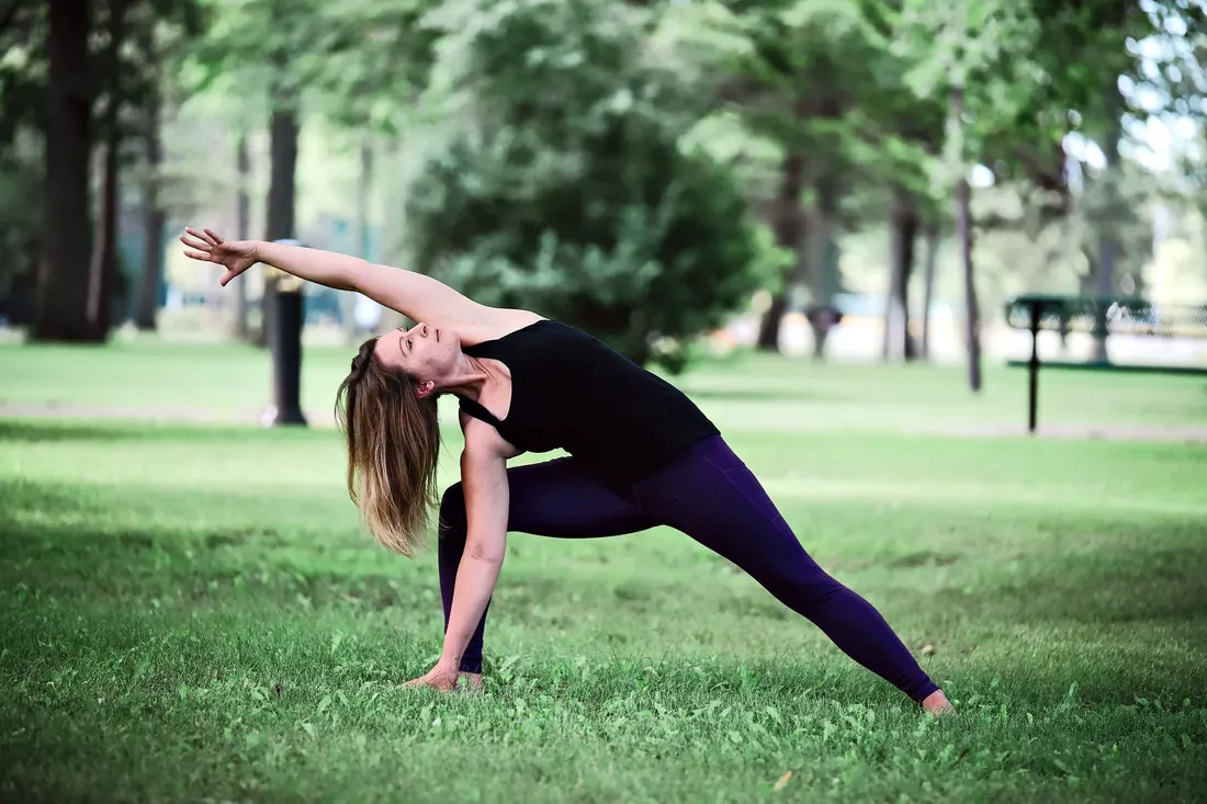 Yoga by the lake: A side stretch on the lawn